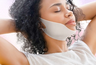 a person with a v-line face mask on