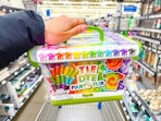 hand holding tie dye party tub in walmart aisle