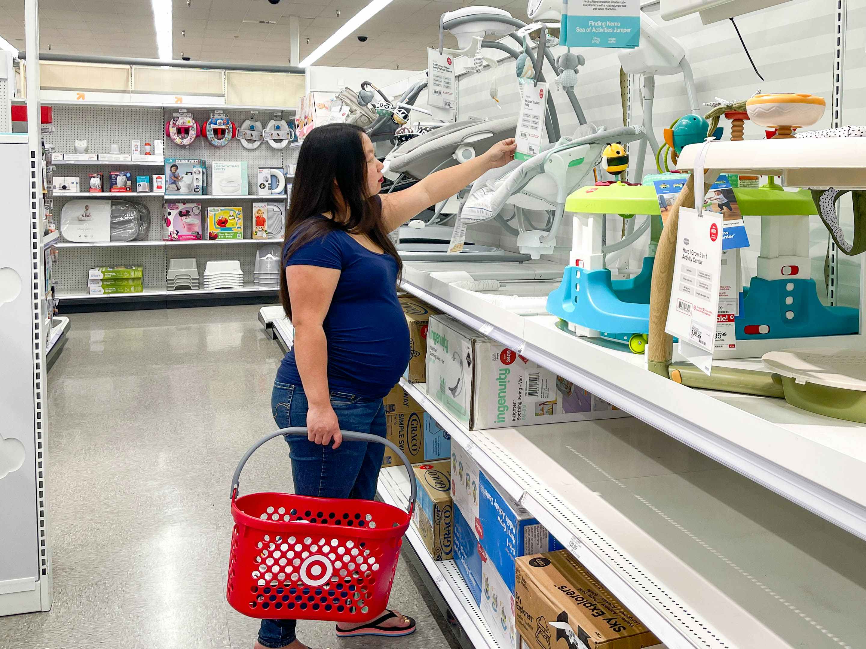 a woman shopping for baby items in target