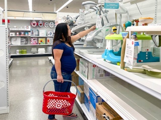 a woman shopping for baby items in target