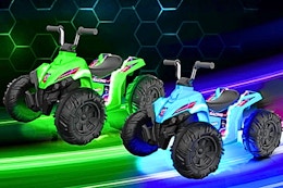 Lifestyle image of the Kids Trax ATVs in blue and green glow in the dark