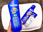 hand holding coppertone sport sunscreen