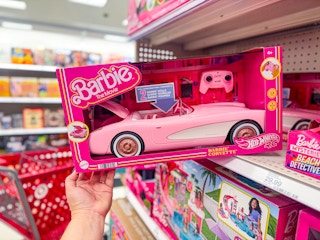 hand grabbing a hot wheels barbie rc corvette off a target shelf