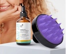 a bottle of hair oil and scalp massager