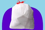 Amazon Basics trash bag on a purple and blue background.