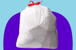 Amazon Basics trash bag on a purple and blue background.