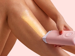 a person using a wax roller on their leg