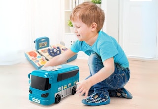young boy playing with toy