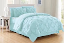 Lifestyle image of the 8-piece bed-in-a-bag set in the color aqua