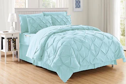 Lifestyle image of the 8-piece bed-in-a-bag set in the color aqua