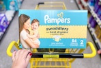 pampers diapers in a yellow shopping cart