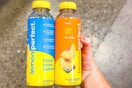 hand holding bottles of lemon perfect water