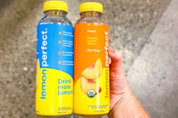 hand holding bottles of lemon perfect water