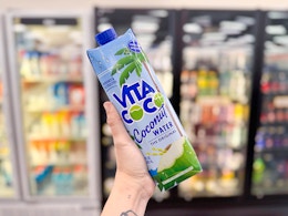 hand holding vita coco coconut water in walgreens