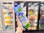 hand holding vita coco coconut water in walgreens