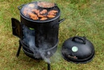 Char-Broil Bullet Charcoal Smoker 16" on the grass outdoors.