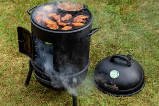 Char-Broil Bullet Charcoal Smoker 16" on the grass outdoors.