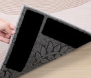 a rug with rug tape underneath 