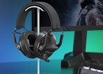 a headset on a stand next to a computer