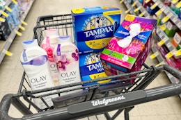 tampax tampons, always pads, and olay body wash in a cart
