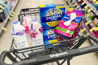 tampax tampons, always pads, and olay body wash in a cart