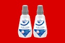 crest gum care mouthwash on a red background