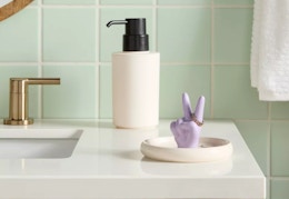 ceramic ring dish sitting on a bathroom countertop
