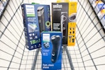 philips and braun electric shavers in a cart
