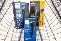 philips and braun electric shavers in a cart
