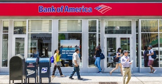 People walking outside of a Bank of America