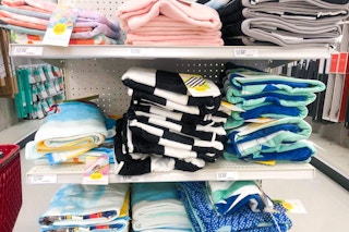 sun squad beach towels sitting on a target shelf