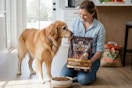 Wellness Core+ Dry Dog Food B06WRVNHZP woman and dog in kitchen with bag in front of dog food bowl