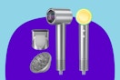 A grey ionic hair dryer with a concentrating nozzle and a diffuser attachment.