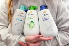 person holding dove body washes
