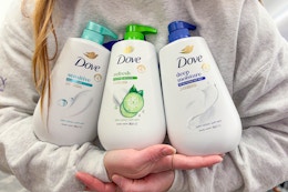 person holding dove body washes