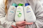 person holding dove body washes