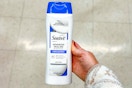 hand holding suave advanced healing lotion