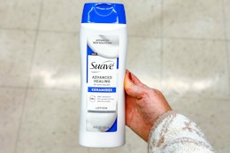 hand holding suave advanced healing lotion
