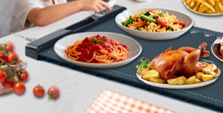 food on plates on a food warming tray