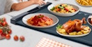 food on plates on a food warming tray