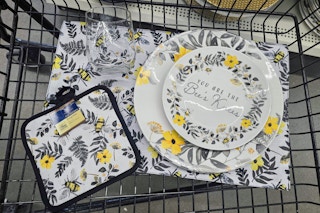 bee themed dinnerware in a cart