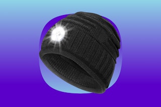 A black knit beanie hat with a headlamp built into it