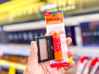 hand holding maybelline baby lips and eyeshadow single