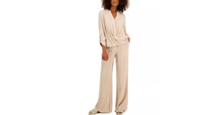 a woman wearing a matching sand color set