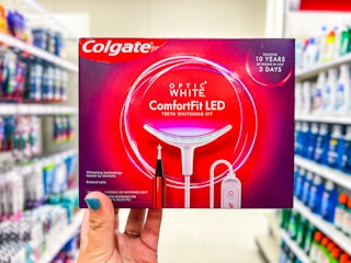 hand holding a Colgate LED Teeth Whitening Kit