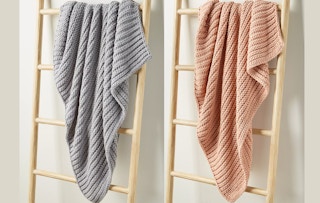 a grey and light pink chunky throw blanket