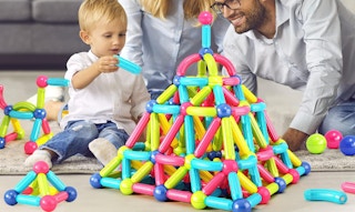 a kids playing with magnetic blocks