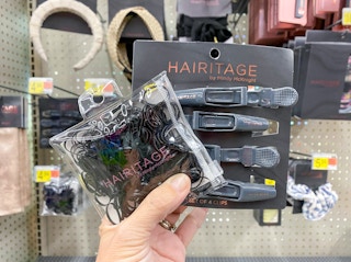 hand holding hairitage rubberbands and clips