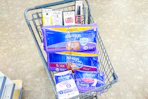 shopping cart with always and olay products