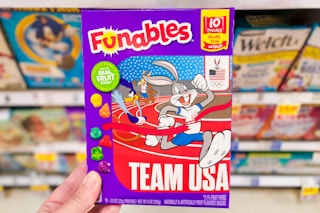 hand holding a box of funables fruit snacks